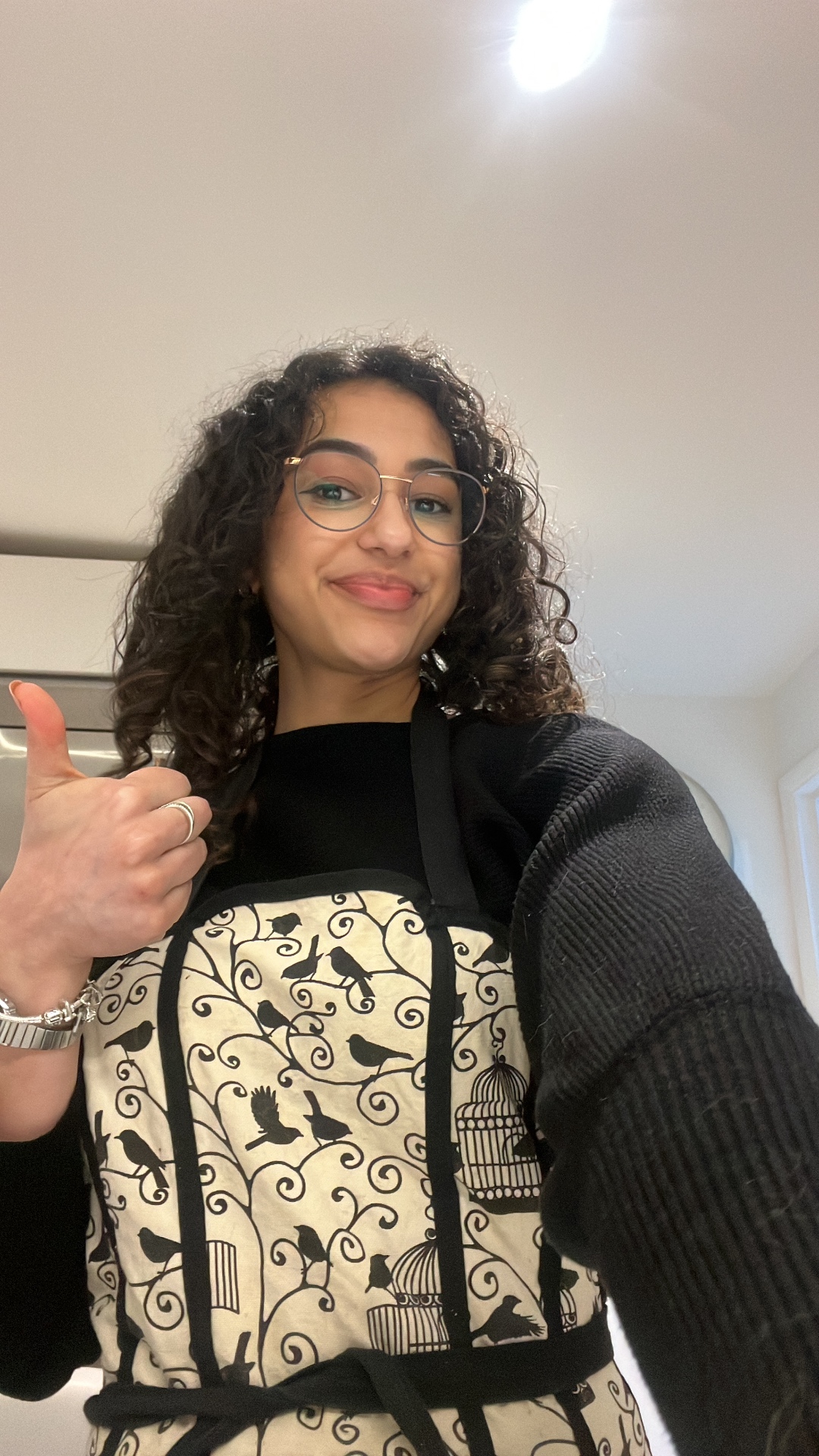 Lina in her kitchen apron, ready to bake